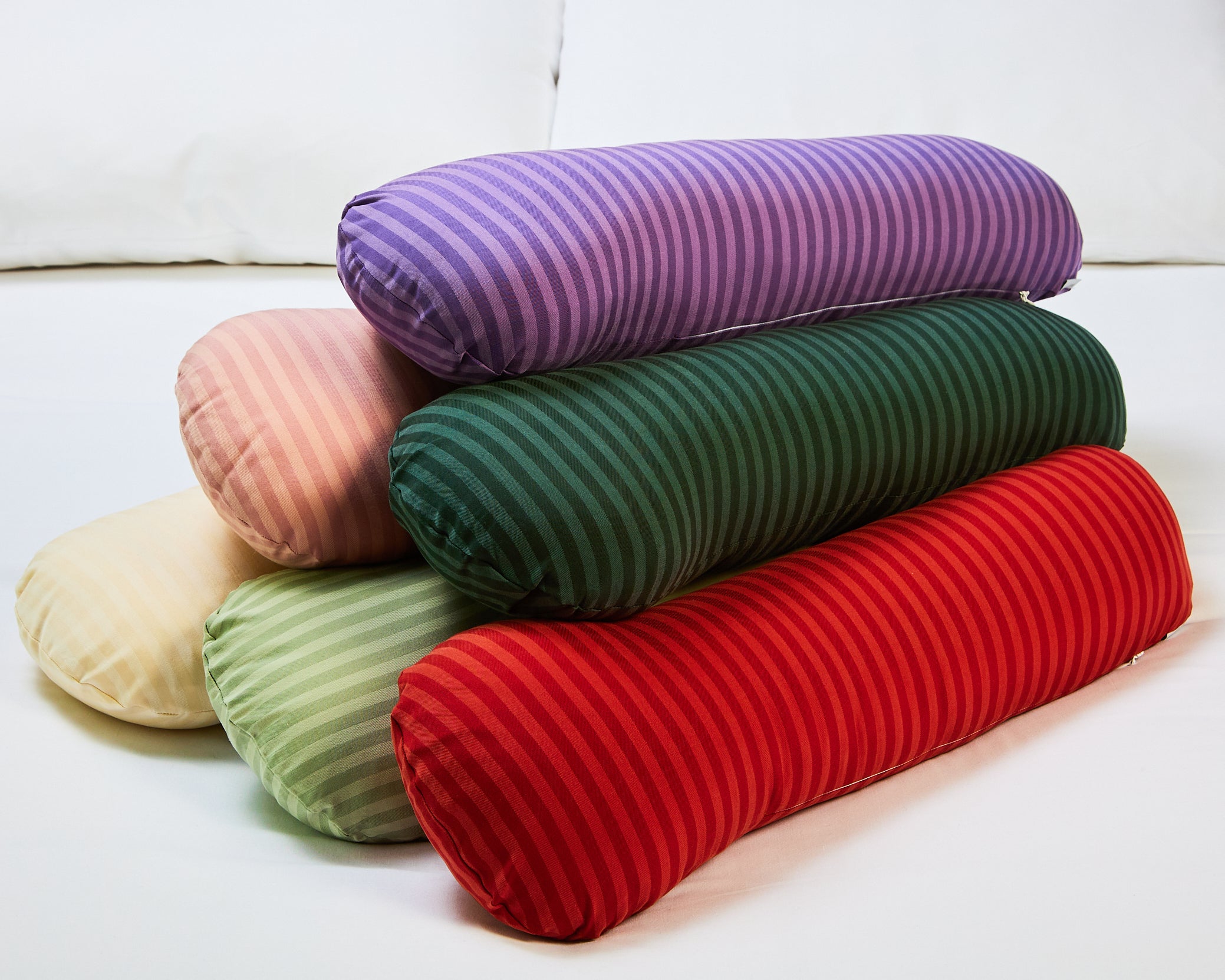 Different colour options of weighted sleeper pillows