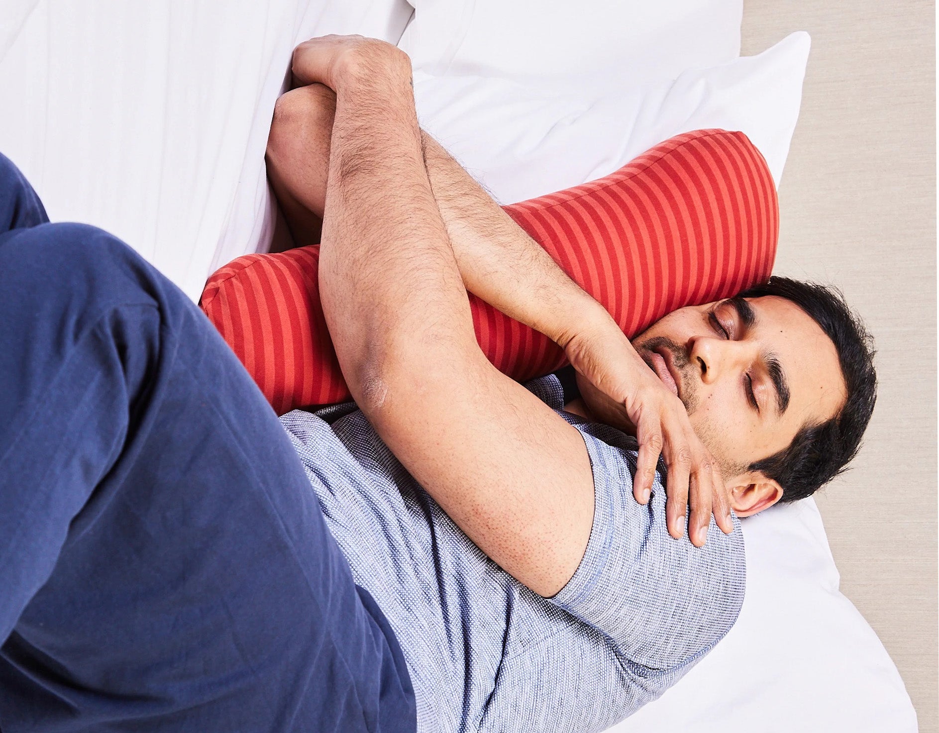 Man sleeping with his sleeping pillow