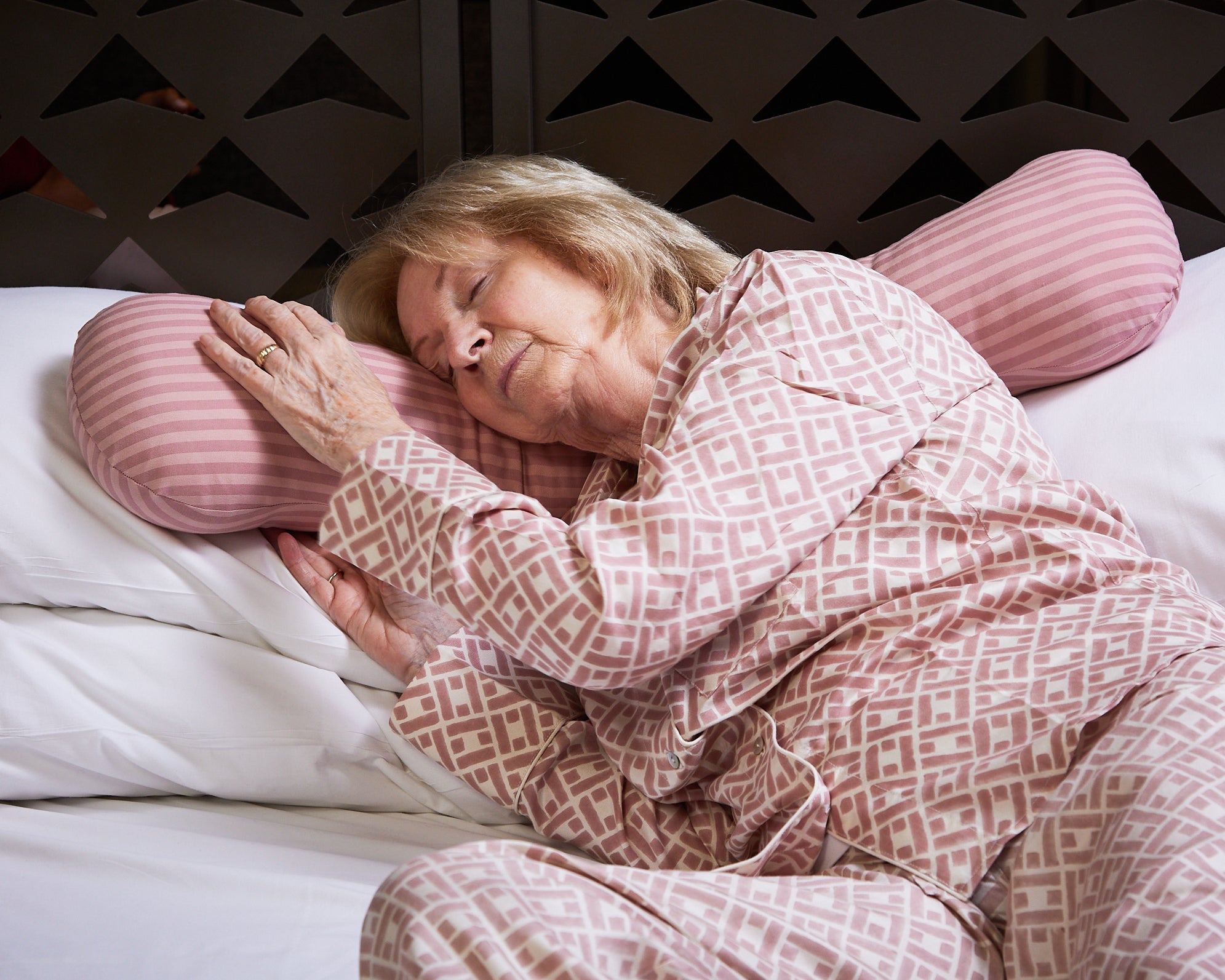 Adult women using weighted body pillow for sleeping