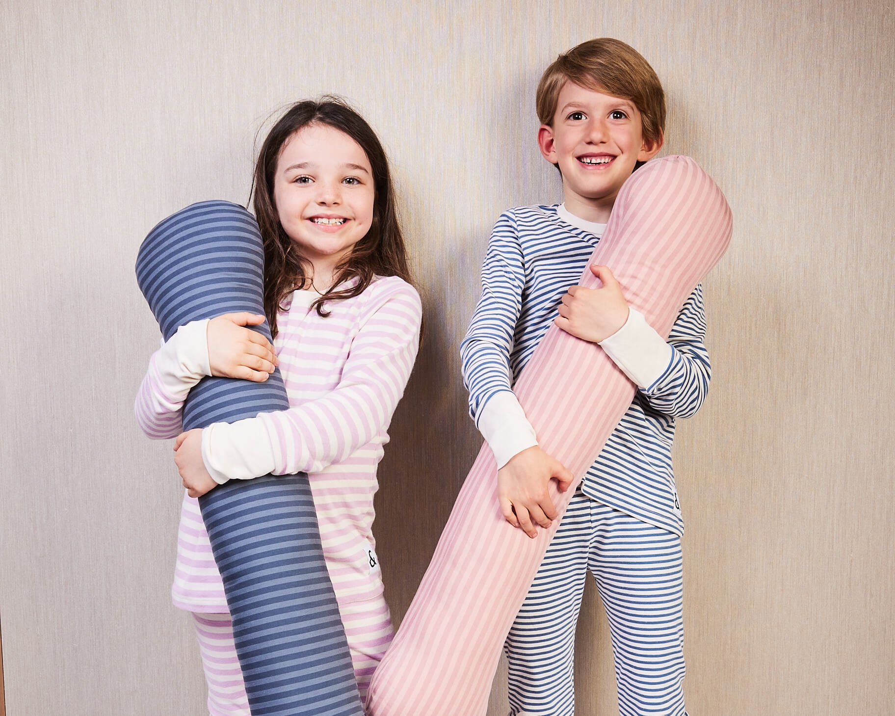 Young kids enjoying their weighted sleep pillow