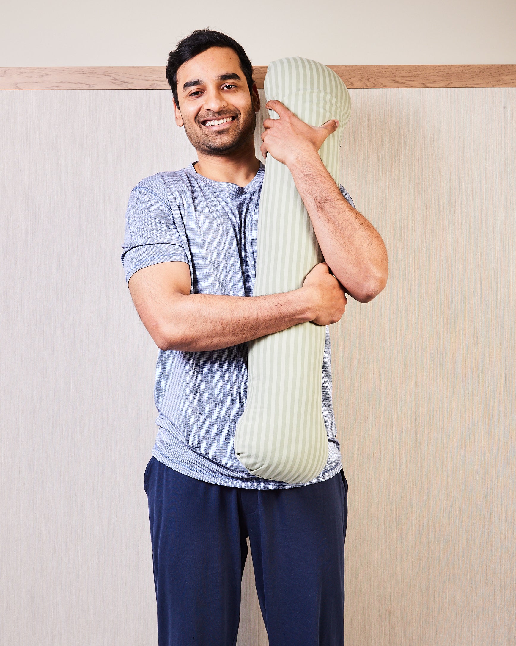 Male happy hugging his weighted body pillow