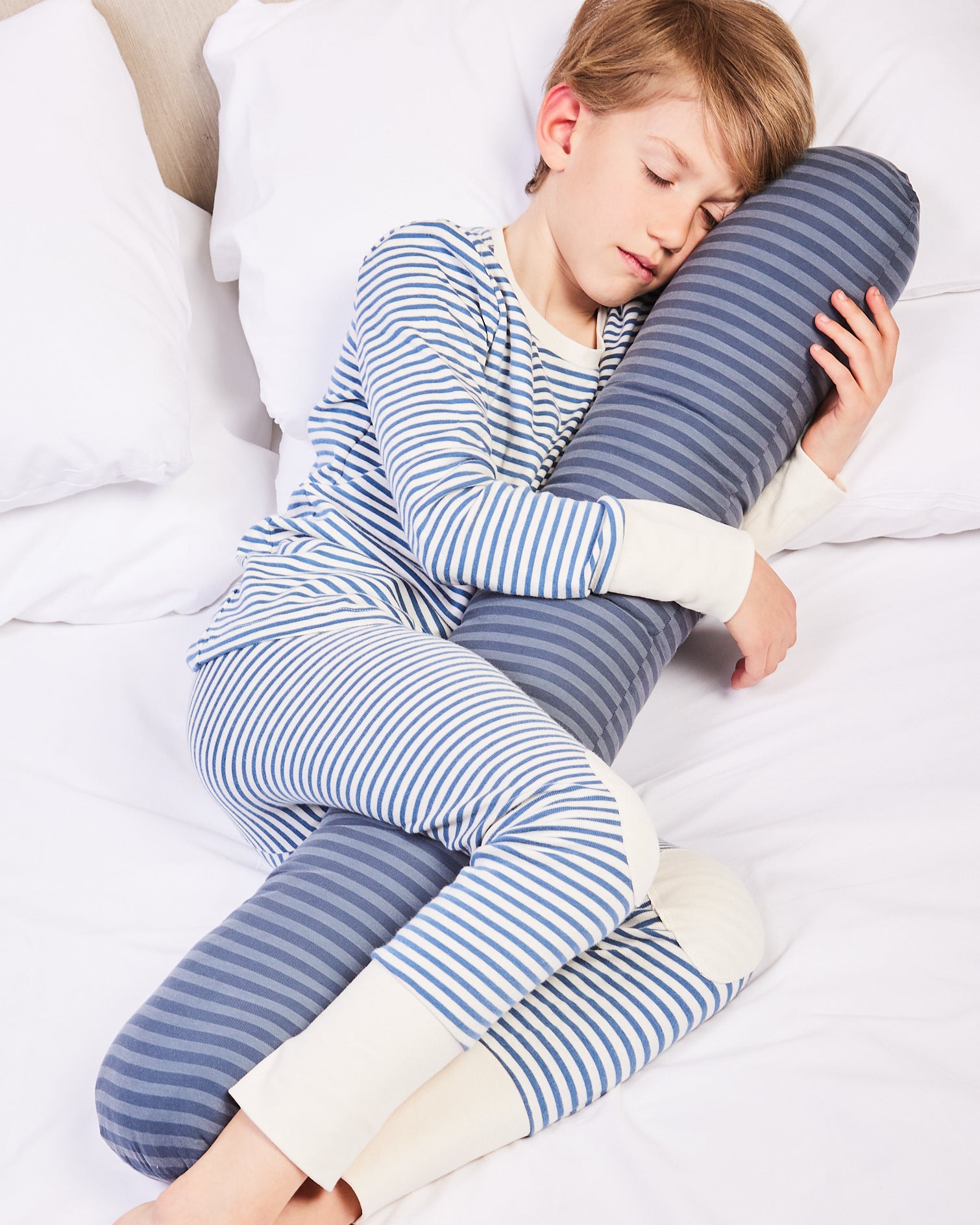 Young boy sleeping better with his weighted pillow